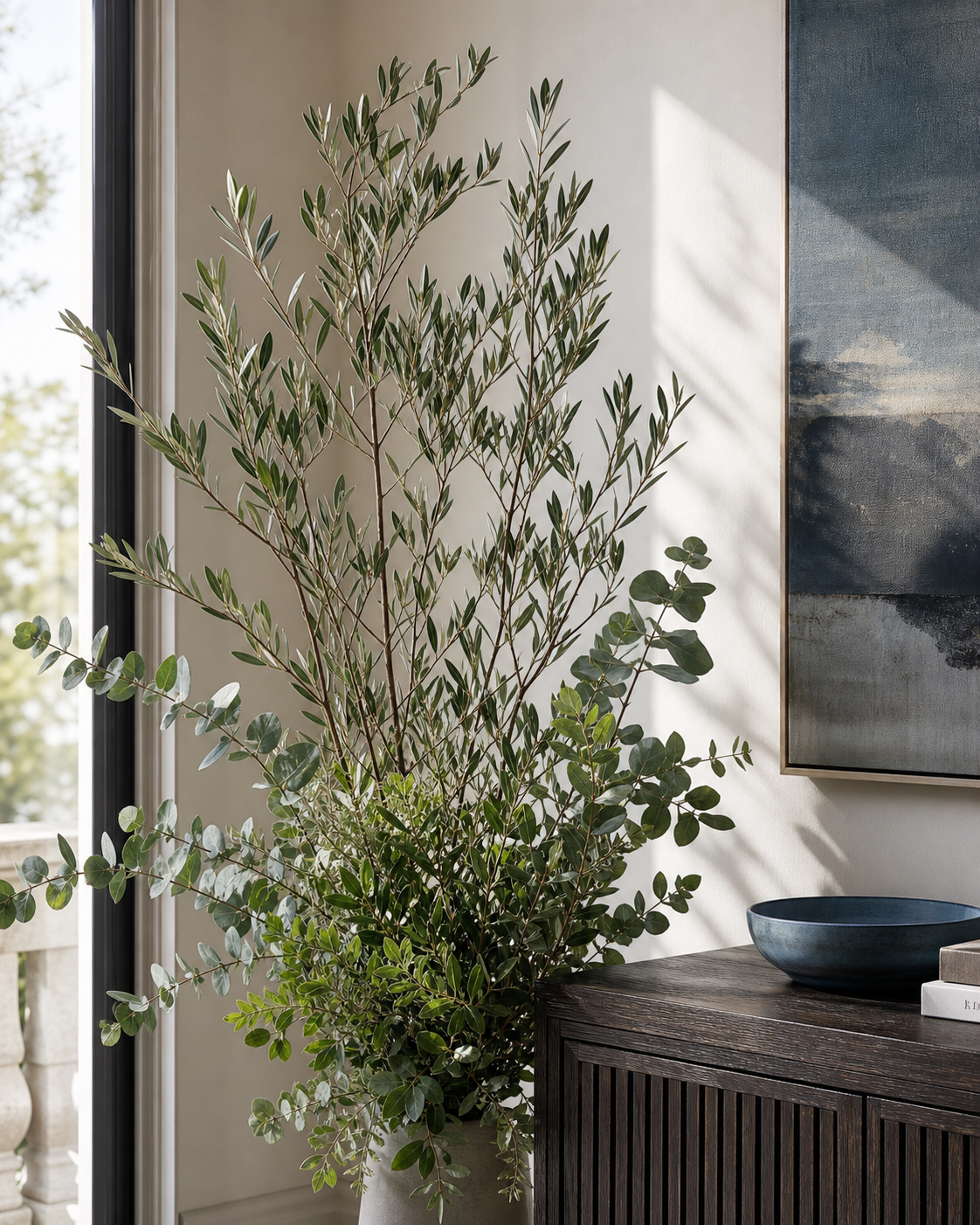 Artificial olive and eucalyptus branches in a living room